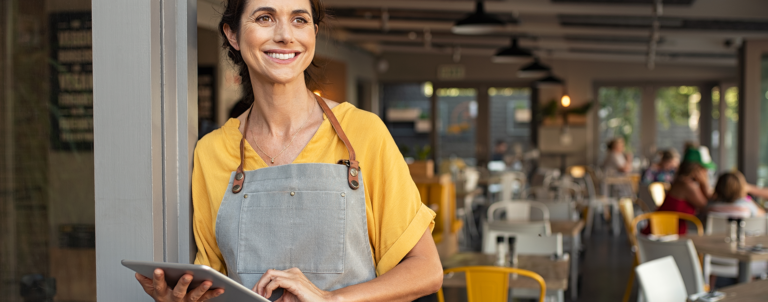 Restaurant owner on laptop