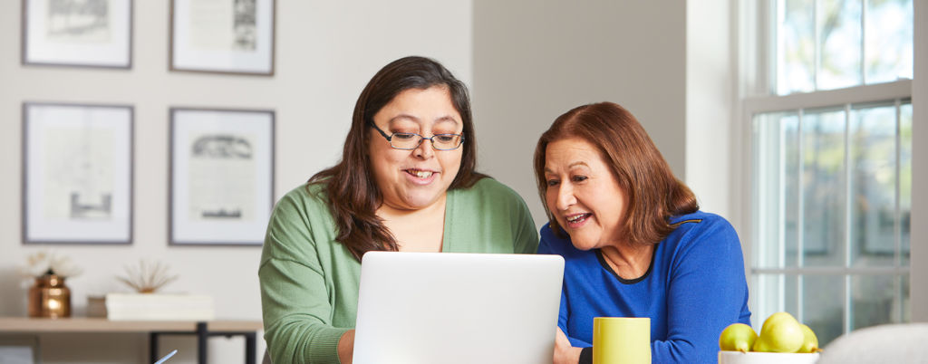 Two women using computer