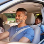 Dad in car with teen daughter