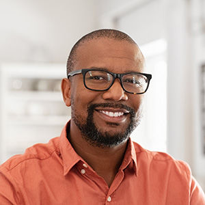 Young African American man with glasses and a beard
