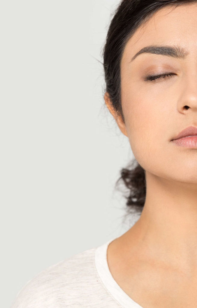 Close up of woman's face with eyes closed