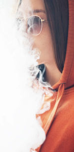 Young woman vaping