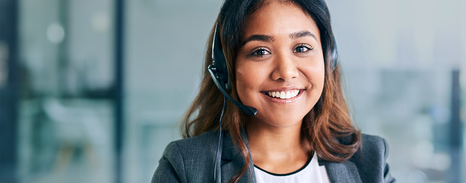 Young woman wearing a call center headset