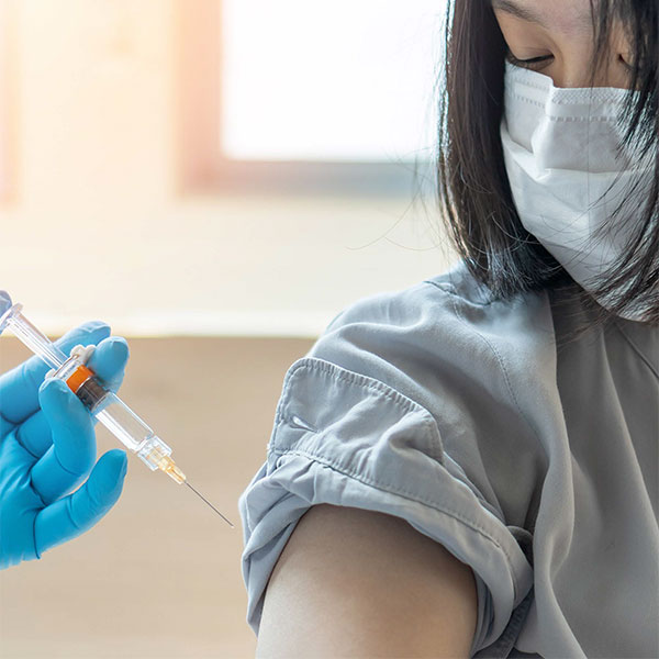 Young woman receiving a vaccine