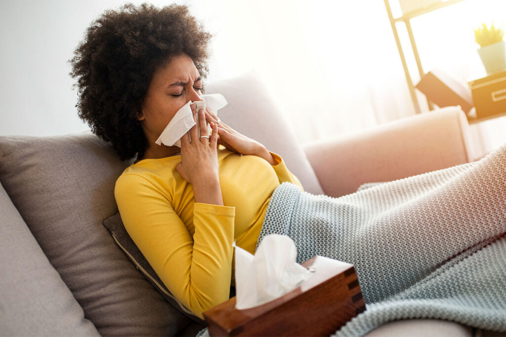 Woman sick on the couch