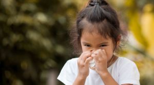 Girl sneezing