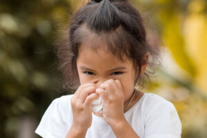 Girl sneezing