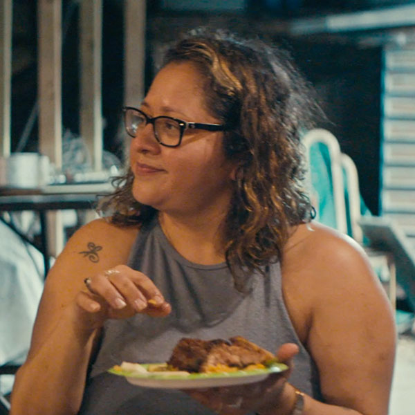 Edna holding a plate of food photo