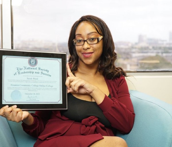 Community Health Choice Member and CareerReady Scholar Sarah shows off her certificate designating her a member of The National Society of Leadership and Success.