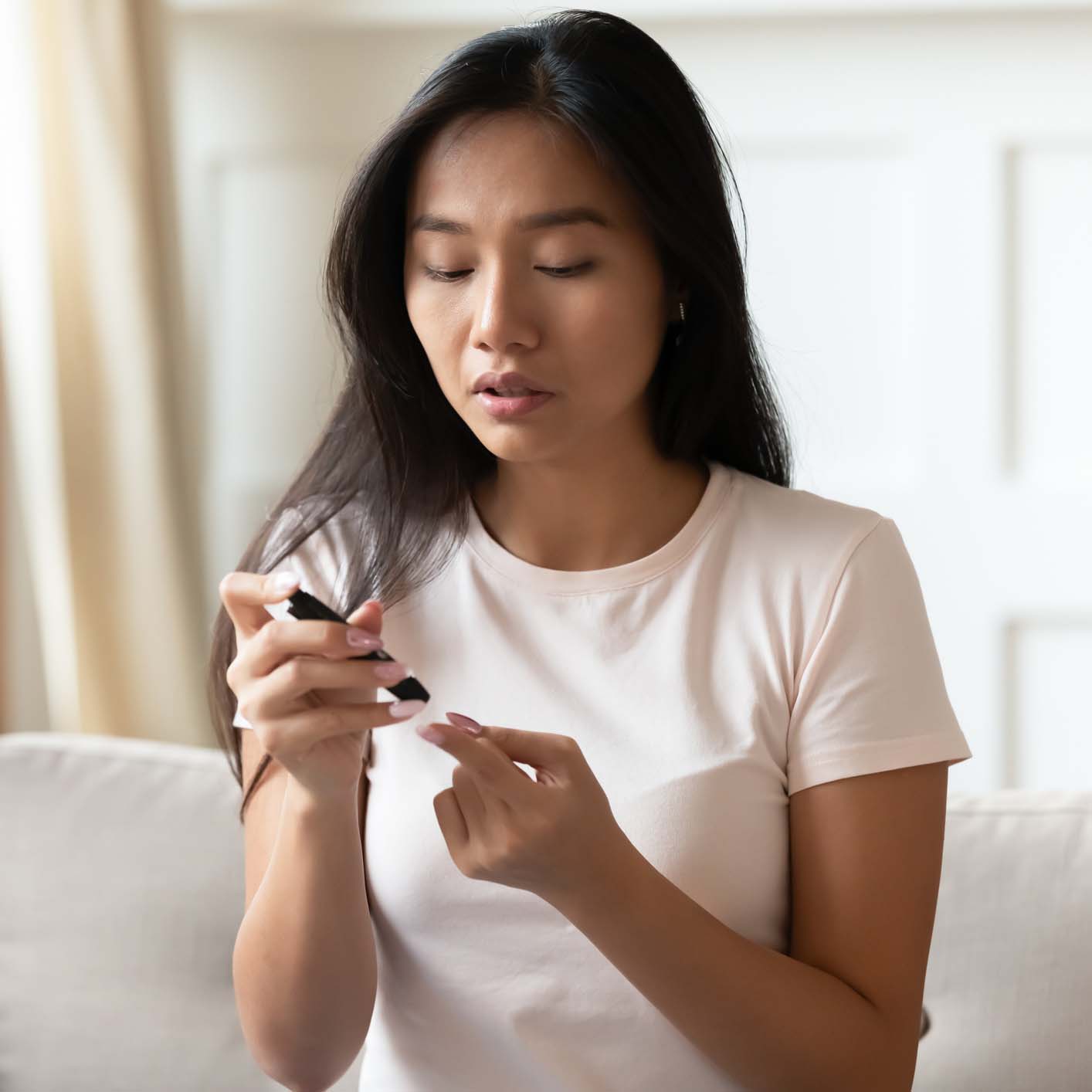 Woman checking blood sugar levels