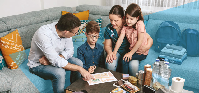 Family making emergency hurricane plan.