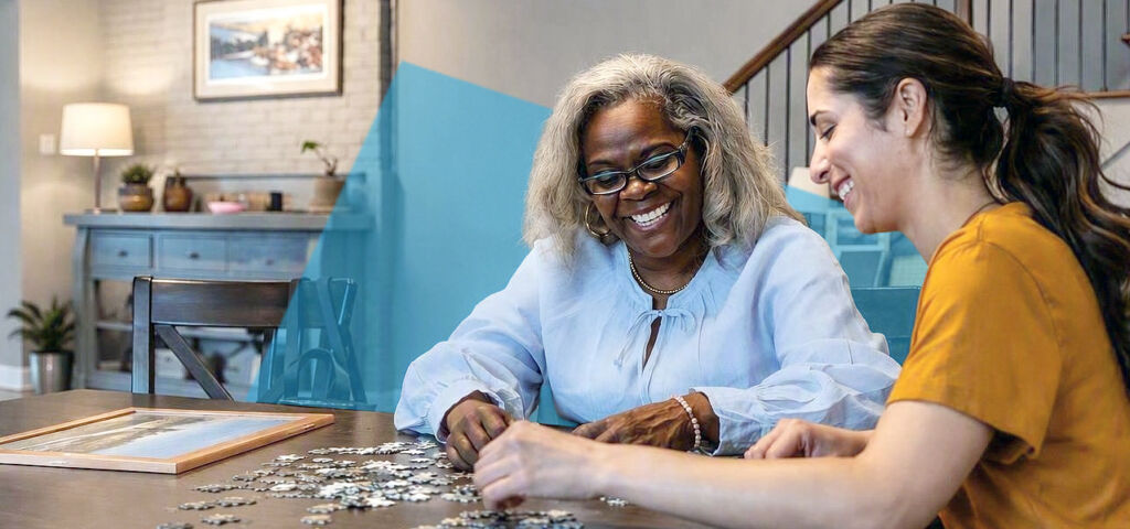 Happy woman doing jigsaw puzzle